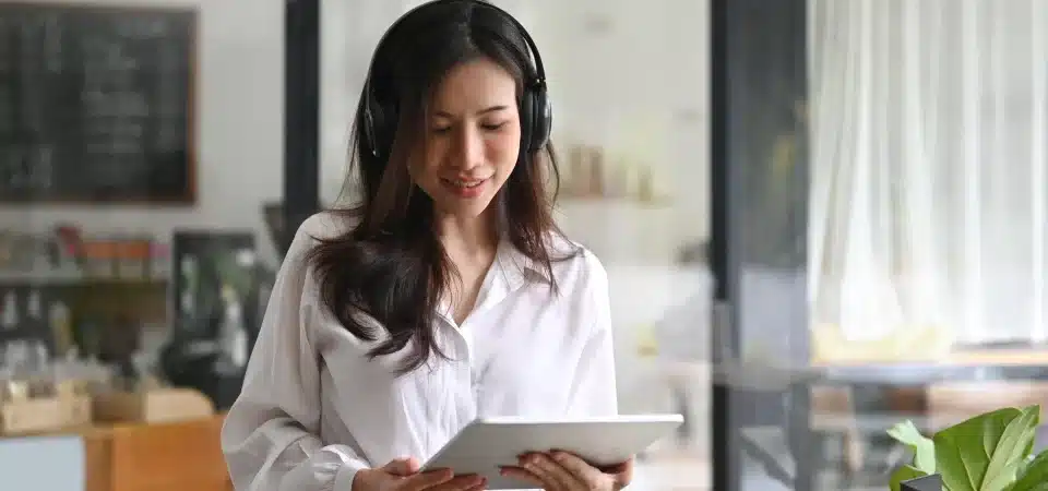 woman listening to music Learning AP best practices cevinio ap automation blog