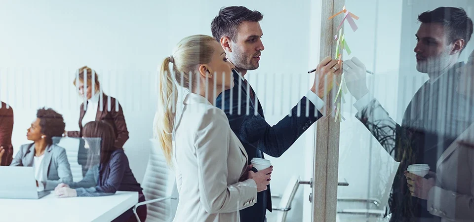 people working in an office room change management in accounts payable cevinio ap automation blog post